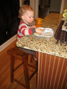 Eating at the counter like a big guy. Gosh, he is getting so big!